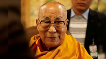 Tibetan spiritual leader, the Dalai Lama, offers blessings to his followers at his Himalayan residence in the northern hill town of Dharamshala, India, December 20, 2024. File Image/Reuters