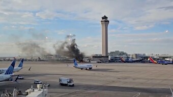 The American Airlines aircraft caught fire while parked at the Denver Airport. Image courtesy: Screengrab from X.com/@BNONeww