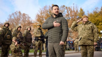 Ukraine's President Volodymyr Zelenskiy sings the national anthem during his visit in Kherson, Ukraine, November 14, 2022. (Photo: Reuters)