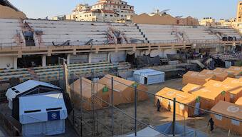 Displaced Palestinians take shelter in a tent camp set up at Palestine Stadium, which was damaged during the Israeli offensive, in Gaza City, March 11, 2025. Reuters
