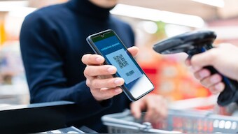An Asian man contactless payment with QR code in supermarket. File Photo/Representational Image