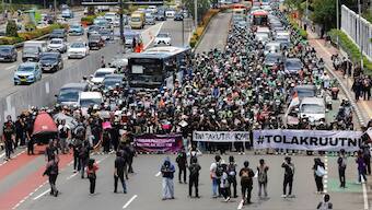 People take part in a protest against revisions to the country's military law, which will allocate more civilian posts for military officers, outside the Indonesian parliament, in Jakarta, Indonesia, March 20, 2025. File Image/Reuters