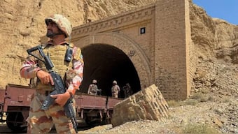 Pakistan army soldiers stand at a tunnel where the Jaffar Express train was attacked by the Baloch separatists, in Bolan, Balochistan, Pakistan. (IMAGE: REUTERS)