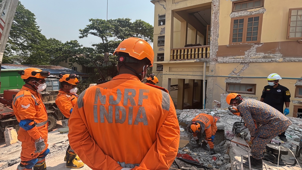 Indian and Myanmar rescuers try to carry a dead body at U Hla Thein Buddhist monastery that collapsed in Friday's earthquake in Mandalay, Myanmar, on Monday. AP Indian and Myanmar rescuers try to carry a dead body at U Hla Thein Buddhist monastery that collapsed in Friday's earthquake in Mandalay, Myanmar, on Monday. AP