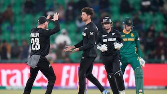 Mitchell Santner celebrates with teammates after getting the key wicket of Rassie van der Dussen during the Champions Trophy semi-final between New Zealand and South Africa in Lahore. AP