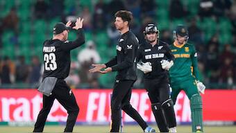 Mitchell Santner celebrates with teammates after getting the key wicket of Rassie van der Dussen during the Champions Trophy semi-final between New Zealand and South Africa in Lahore. AP