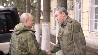 Russian President Vladimir Putin shakes hands with Chief of the General Staff of Russian Armed Forces Valery Gerasimov as he visits the army command centre in the course of Russia-Ukraine conflict in the Kursk region, Russia, March 12, 2025, in this still image taken from video. Kremlin.ru via Reuters