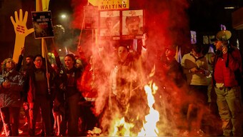 Relatives and supporters of Israelis held hostage in the Gaza Strip by Palestinian militants since October 2023, lift placards during a rally calling on the government for a deal that would bring all the remaining captives back, outside the prime minister residence in Jerusalem on March 2, 2025. Image- AFP