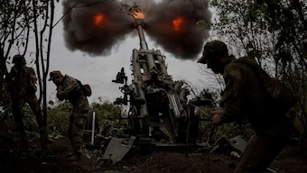 Ukrainian service members fire a shell from a M777 Howitzer at a front line, as Russia's attack on Ukraine continues, in Kharkiv Region, Ukraine. File Image- Reuters