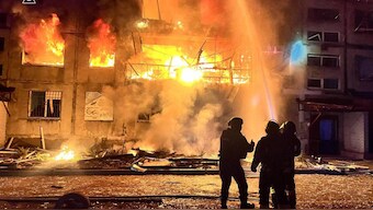 firefighters mannning a hose to extinguish a structural fire following a Russian strike in Dobropillia, Donetsk region.- AFP Photo