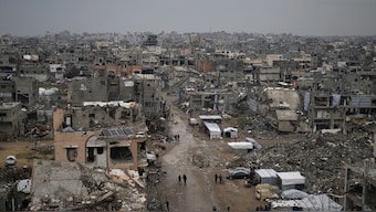 Palestinians walk surrounded by the rubble of destroyed homes and building in the Zeitoun neighborhood of Gaza City, Friday, March 7, 2025.  Image- AP