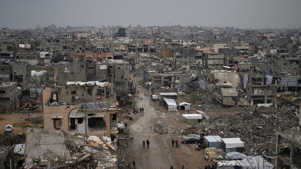 Palestinians walk surrounded by the rubble of destroyed homes and building in the Zeitoun neighborhood of Gaza City, Friday, March 7, 2025. Image- AP Palestinians walk surrounded by the rubble of destroyed homes and building in the Zeitoun neighborhood of Gaza City, Friday, March 7, 2025. Image- AP