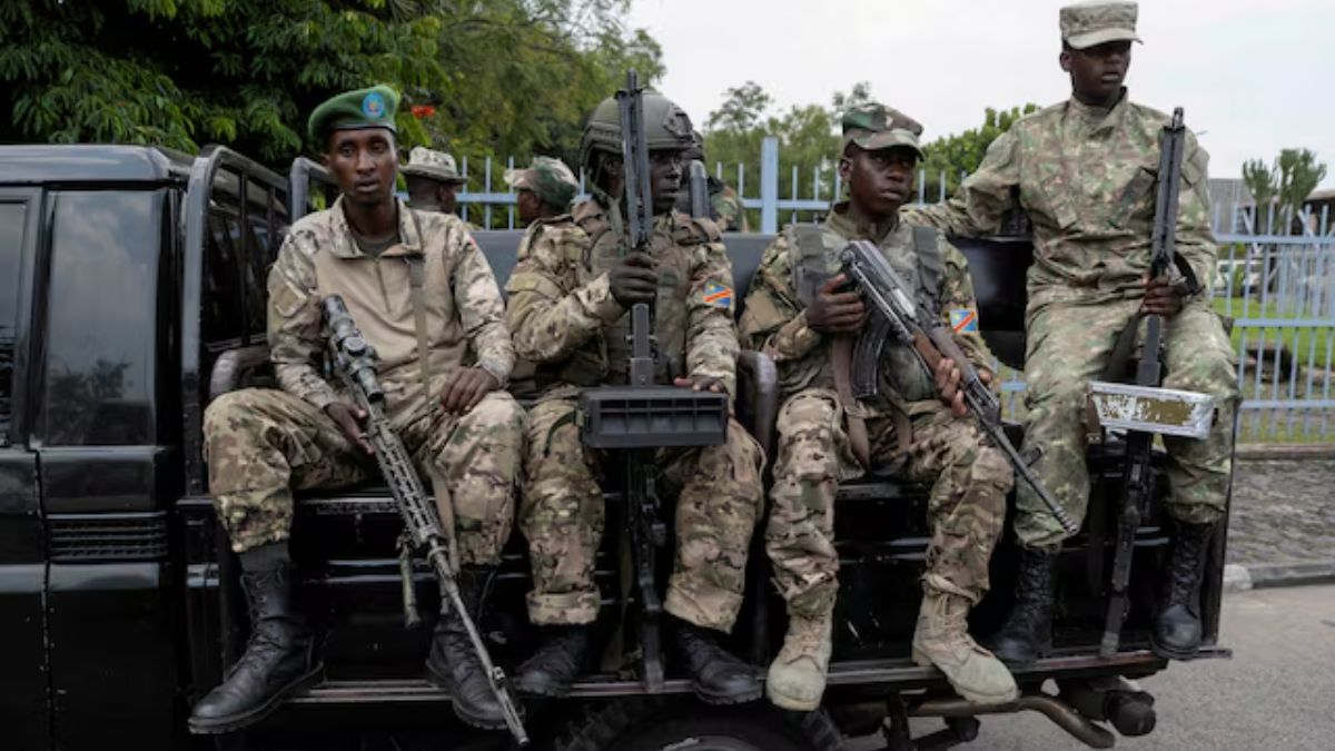 M23 rebels sit on a truck during the escort of captured FDLR members (not pictured) to Rwanda for repatriation, at the Goma-Gisenyi Grande Barrier border crossing, March 1, 2025. Image- Reuters M23 rebels sit on a truck during the escort of captured FDLR members (not pictured) to Rwanda for repatriation, at the Goma-Gisenyi Grande Barrier border crossing, March 1, 2025. Image- Reuters
