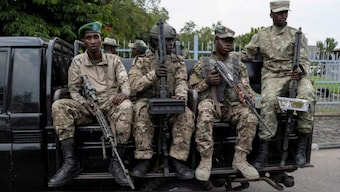 M23 rebels sit on a truck during the escort of captured FDLR members (not pictured) to Rwanda for repatriation, at the Goma-Gisenyi Grande Barrier border crossing, March 1, 2025. Image- Reuters