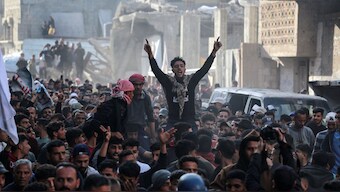 Palestinians take part in an anti-Hamas protest, calling for an end to the war with Israel, in Beit Lahia in the northern Gaza Strip on March 26, 2025. Image- AFP