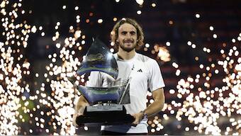 Stefanos Tsitsipas with the trophy at Dubai Championships. Image: Reuters