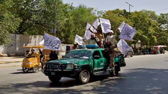 Members of the Taliban carrying flags participate in a rally to mark the third anniversary of the fall of Kabul, in Kabul, Afghanistan, on August 14, 2024. Reuters File 