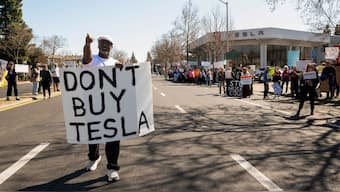 People protest against Tesla and Elon Musk outside of a Tesla dealership in Palo Alto, California, US, March 8, 2025. File Image/Reuters