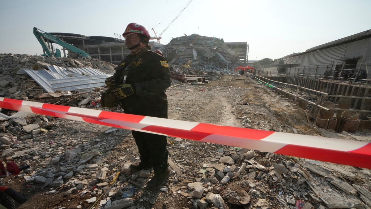 A rescuer walks at the site of a high-rise building under construction that collapsed after a 7.7 magnitude earthquake in Bangkok, Thailand, on Friday. AP A rescuer walks at the site of a high-rise building under construction that collapsed after a 7.7 magnitude earthquake in Bangkok, Thailand, on Friday. AP