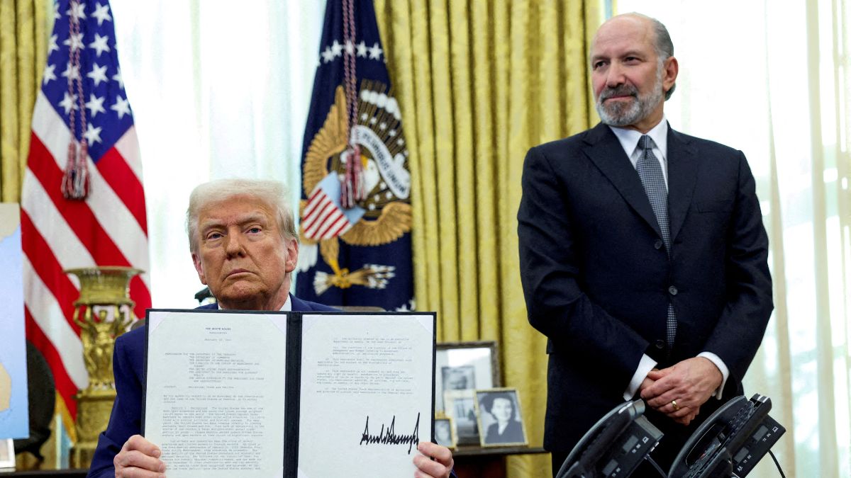 US President Donald Trump holds an executive order about tariffs increase, flanked by US Commerce Secretary Howard Lutnick, in the Oval Office of the White House in Washington, DC, US, February 13, 2025. File Image/Reuters US President Donald Trump holds an executive order about tariffs increase, flanked by US Commerce Secretary Howard Lutnick, in the Oval Office of the White House in Washington, DC, US, February 13, 2025. File Image/Reuters