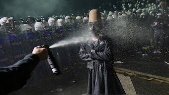 Riot police officers use pepper spray to clear a protester during a protest after Istanbul's Mayor Ekrem Imamoglu was arrested and sent to prison, in Istanbul, Turkey, on Sunday. AP