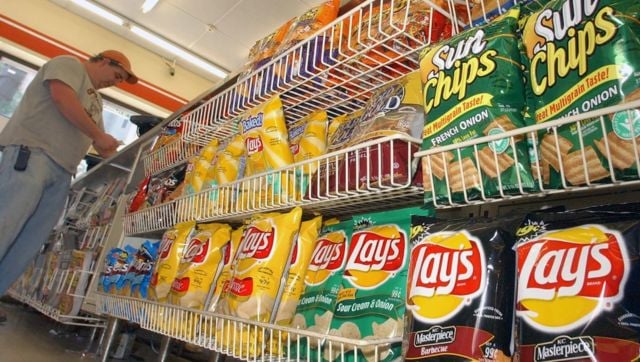 Rows of ultraprocessed potato chips are placed at a convenience store in Boston. File image/AP