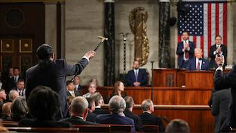 Representative Al Green, left, shouts as President Donald Trump addresses a joint session of Congress at the Capitol in Washington, March 4, 2025. AP