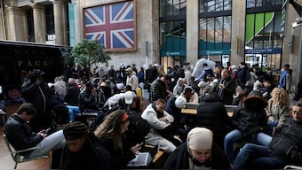 Passengers wait inside the departure hall of a train station, France. Reuters/File Photo
