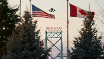Canadian and American flags fly on the Canadian side of the Ambassador Bridge in Windsor, Ontario. AFP/Representative image