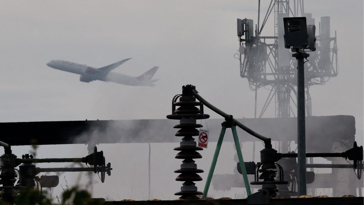 A plane takes off, as smoke rises from an area of an electrical substation a day after it caught fire and wiped out power at Heathrow International Airport, near London, Britain, March 22, 2025. Reuters A plane takes off, as smoke rises from an area of an electrical substation a day after it caught fire and wiped out power at Heathrow International Airport, near London, Britain, March 22, 2025. Reuters