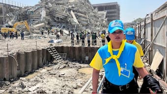 Thai King's volunteers work near the site of a collapsed building after a strong earthquake struck central Myanmar on Friday, earthquake monitoring services said, which affected Bangkok as well with hundreds of people pouring out of buildings in the Thai capital in panic after the tremors, in Bangkok, Thailand, March 28, 2025. REUTERS