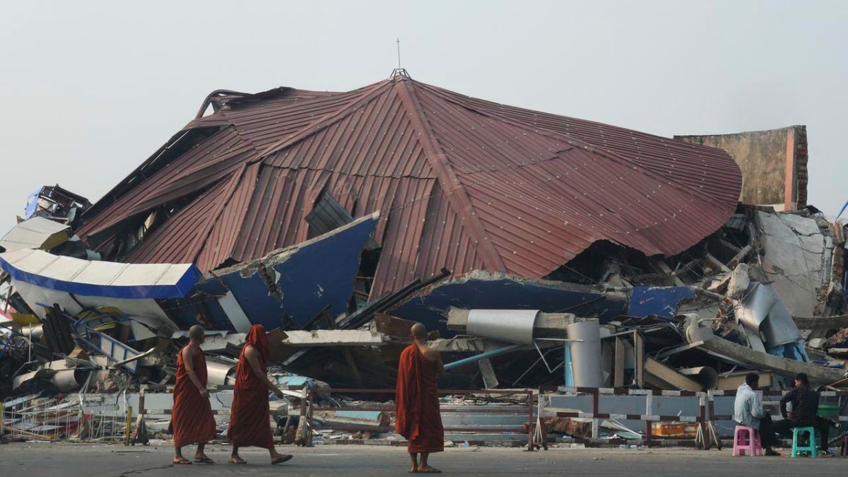 Buddhist monks walk past a collapsed building after a powerful earthquake in Naypyitaw, Myanmar, March 29, 2025. AP Buddhist monks walk past a collapsed building after a powerful earthquake in Naypyitaw, Myanmar, March 29, 2025. AP