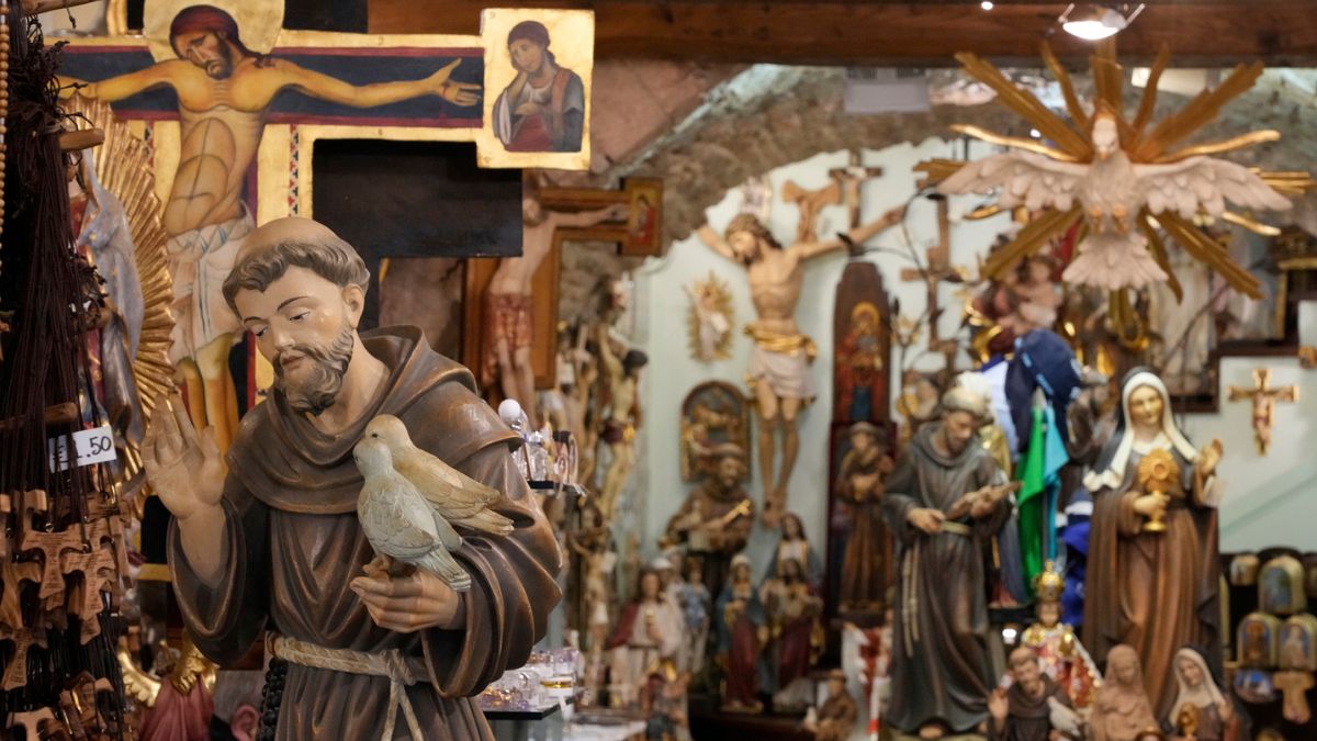 A votive statue of Italy's patron saint, St. Francis, left, is on display at a shop in Assisi, Italy. AP
 A votive statue of Italy's patron saint, St. Francis, left, is on display at a shop in Assisi, Italy. AP