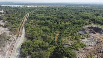 This image taken from video Wednesday, Feb. 19, 2025, shows the path of mine waste in a river near a Sino-Metals Leach Zambia mine near Kitwe. AP
