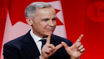 Former Bank of Canada and Bank of England governor Mark Carney makes a "W" gesture to signify his win in the race to become leader of Canada's ruling Liberal Party, and will succeed Justin Trudeau as prime minister, in Ottawa, Canada. Reuters