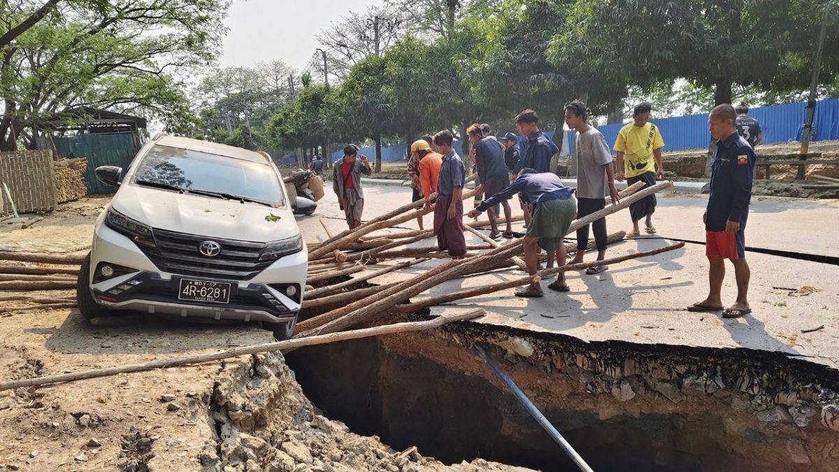 This UGC photo taken and posted by Hla Myo Aung on Facebook on March 28, 2025 shows people trying to save a vehicle from falling into a crack in the road in Sagaing, following an earthquake. Rescuers dug through the rubble of collapsed buildings on March 29 in a desperate search for survivors after a huge earthquake hit Myanmar and Thailand, killing more than 1000 people. Source: AFP This UGC photo taken and posted by Hla Myo Aung on Facebook on March 28, 2025 shows people trying to save a vehicle from falling into a crack in the road in Sagaing, following an earthquake. Rescuers dug through the rubble of collapsed buildings on March 29 in a desperate search for survivors after a huge earthquake hit Myanmar and Thailand, killing more than 1000 people. Source: AFP