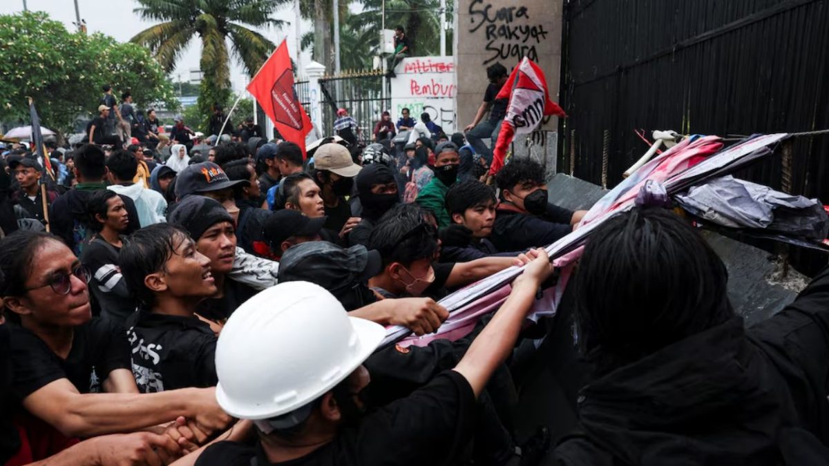 People take part in a protest outside the Indonesian Parliament against revisions to the country's military law, which will allocate more civilian posts for military officers, in Jakarta, Indonesia. Reuters People take part in a protest outside the Indonesian Parliament against revisions to the country's military law, which will allocate more civilian posts for military officers, in Jakarta, Indonesia. Reuters