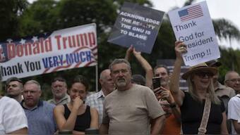 White South Africans demonstrate in support of US President Donald Trump in front of the US embassy in Pretoria, South Africa. Source: AP