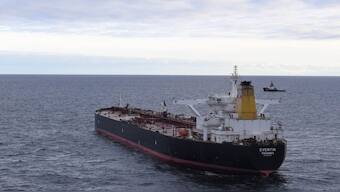 A file handout photo taken and released by the German Central Command for Maritime Emergencies (Havariekommando) on January 10, 2025 shows an aerial view taken from the sensor aircraft DO228 of the tanker 'Eventin', flying the Panama flag, as a towing connection is established from the emergency tug boat Bremen Fighter (back R) at sea north of the German Baltic Sea island of Ruegen. Source: AFP