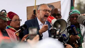 South Africa’s expelled ambassador to the United States, Ebrahim Rasool, speaks upon his arrival at the airport. Source: Reuters