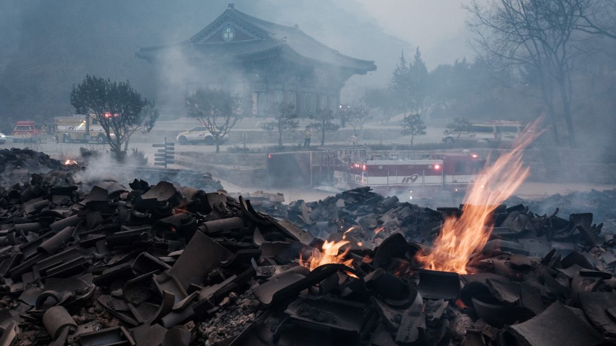 Embers remain among the debris after most of the buildings were burned to the ground in a wildfire at Gounsa Temple in Uiseong on March 26, 2025. AFP Embers remain among the debris after most of the buildings were burned to the ground in a wildfire at Gounsa Temple in Uiseong on March 26, 2025. AFP
