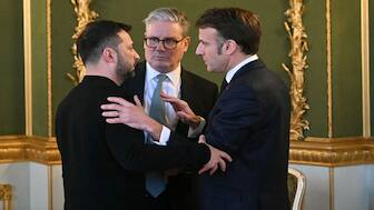 Ukraine's President Volodymyr Zelenskyy, Britain's Prime Minister Sir Keir Starmer, and France's President Emmanuel Macron embrace after holding a meeting during a summit at Lancaster House in central London, UK, on February 2, 2025. (Photo: Reuters)