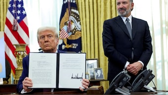 U.S. President Donald Trump holds an executive order about tariffs increase, flanked by U.S. Commerce Secretary Howard Lutnick, in the Oval Office of the White House in Washington, D.C. File image/ Reuters