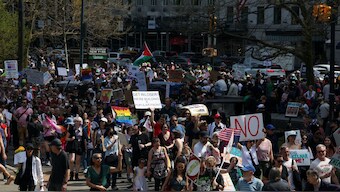 People march into Central Park during a rally to “Protect Migrants, Protect the Planet” in New York City, U.S. Reuters