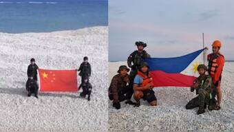 China and Philippines display competing flags on disputed South China Sea sandbank. X