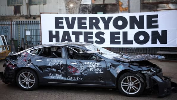 Everyone Hates Elon: London art project becomes outlet for Musk's critics to release anger by smashing Tesla