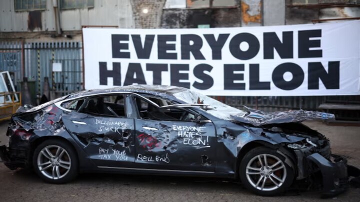 Everyone Hates Elon: London art project becomes outlet for Musk's critics to release anger by smashing Tesla
