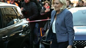 President of the parliamentary group of the French Rassemblement National or National Rally party, Marine Le Pen, leaves the headquarters of the party after a French court sentenced her to a five-year ban on running for elections and a prison term of four years, Paris, France. Image: AFP
