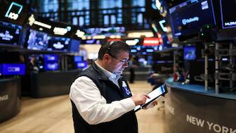 A trader works on the floor of the New York Stock Exchange (NYSE) at the opening bell in New York City on April 1, 2025. AFP