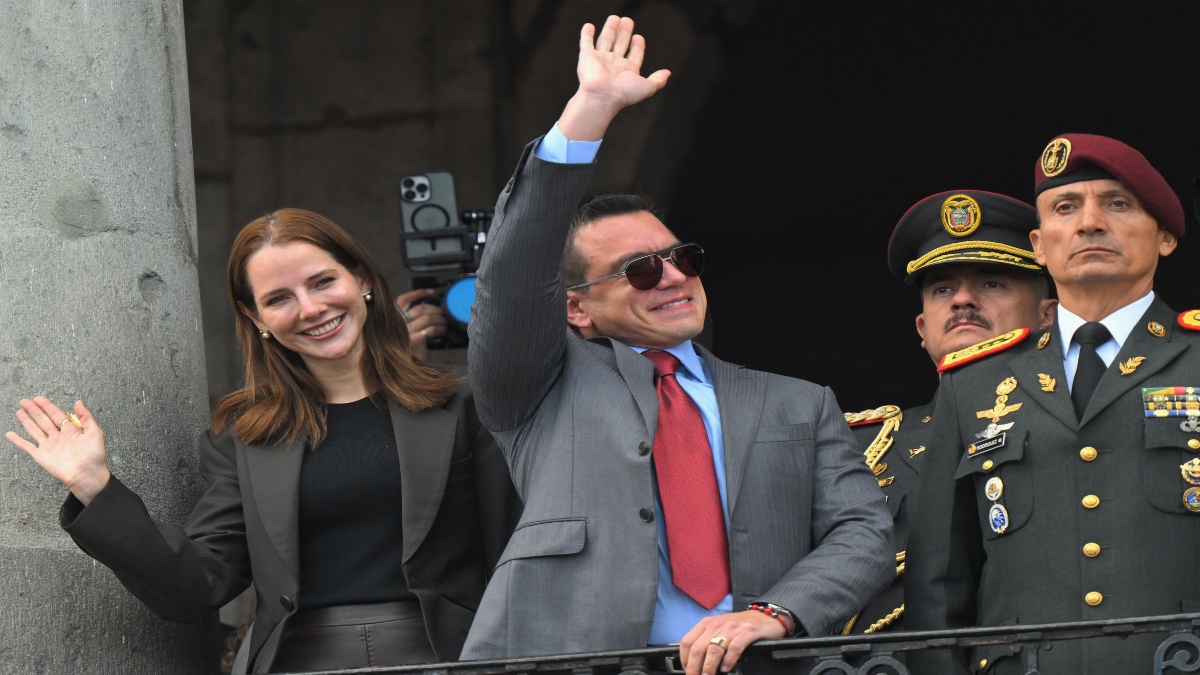 Ecuador's reelected President Daniel Noboa (C) waves to supporters accompanied by his wife, Lavinia Valbonesi (L) and the chief of the Presidential Military House, Milton Rodriguez, from a balcony of the Carondelet Presidential Palace during the changing of the guard ceremony in Quito on April 15, 2025. AFP Ecuador's reelected President Daniel Noboa (C) waves to supporters accompanied by his wife, Lavinia Valbonesi (L) and the chief of the Presidential Military House, Milton Rodriguez, from a balcony of the Carondelet Presidential Palace during the changing of the guard ceremony in Quito on April 15, 2025. AFP